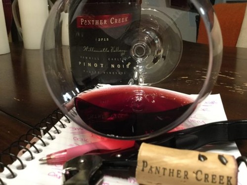 Panther Creek Cellars 2017 Maverick Vineyard Pinot Noir in glass on its side
